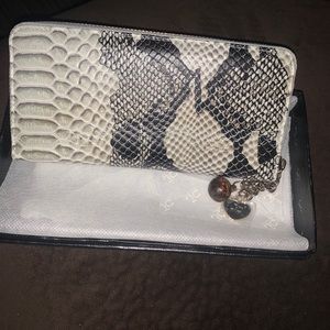 New with tags Jacky Celine snake skin wallet.